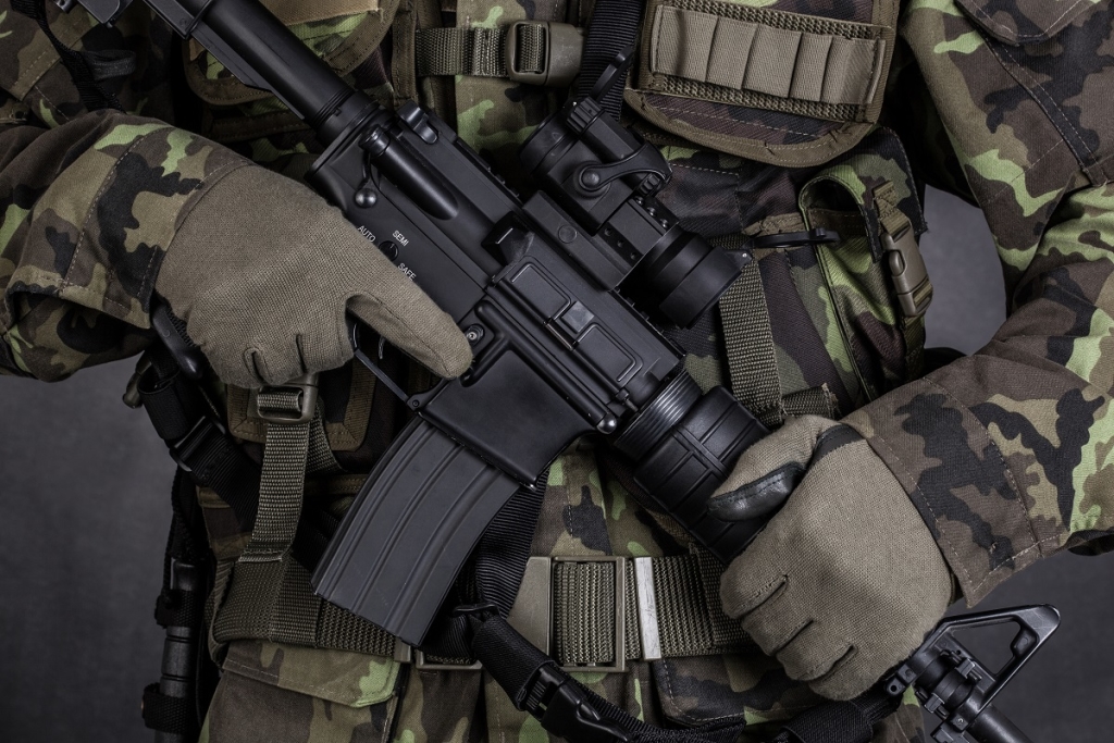 Close-up of a soldier holding modern weapon M4 carbine
