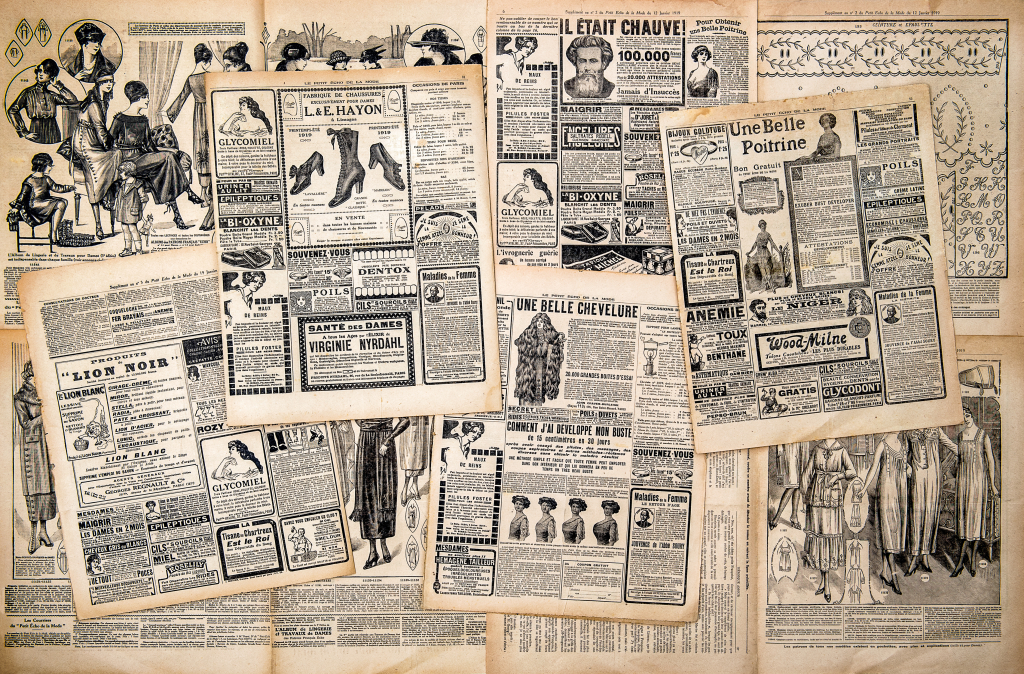 Newspaper pages with antique advertising. Woman's fashion magazine Le Petit Echo de la Mode from 1919