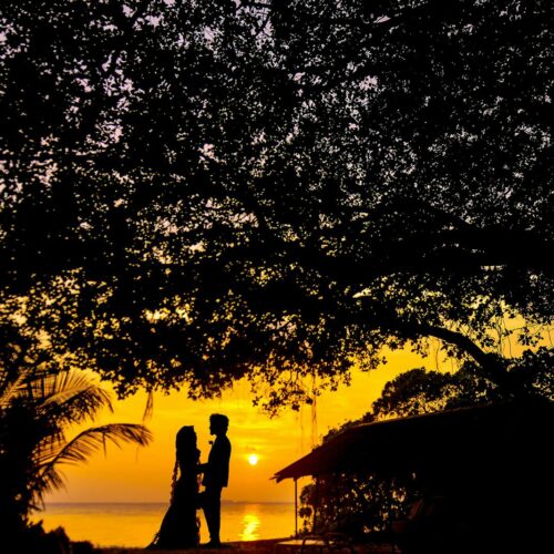 Silhouette Photo of Man and Woman during Sunset