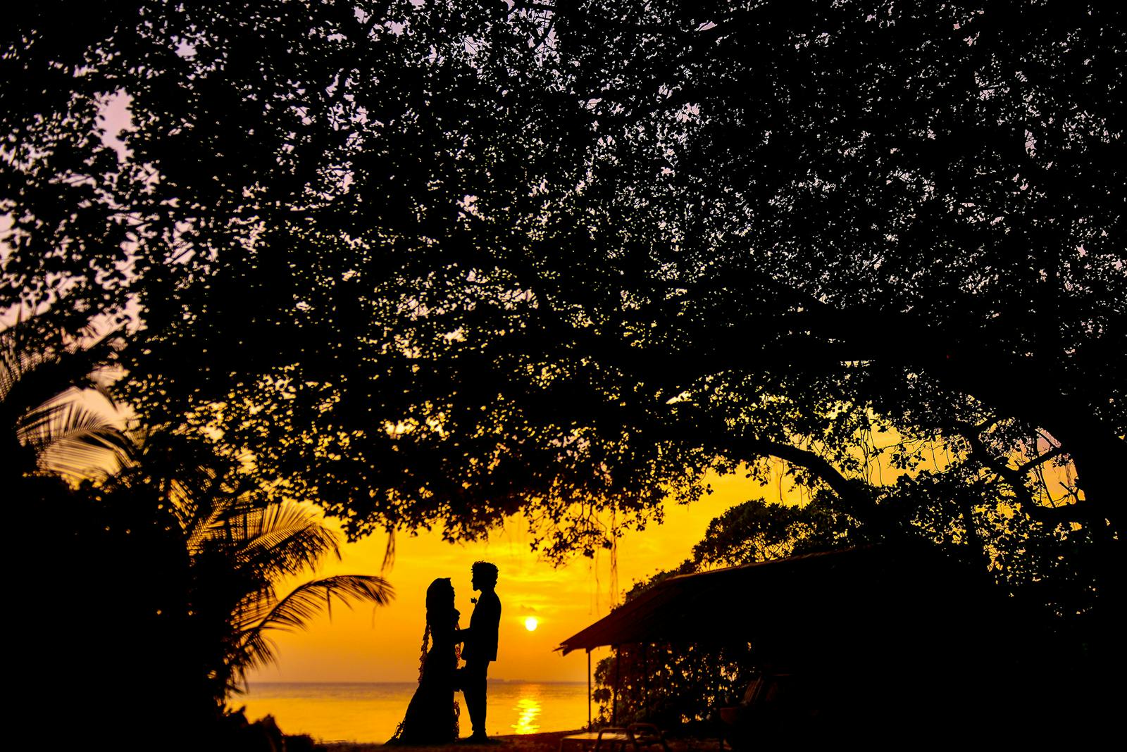 Silhouette Photo of Man and Woman during Sunset